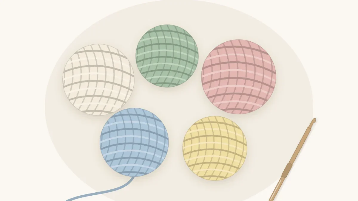 Five yarn balls in cream, sage, dusty rose, pale blue and butter yellow arranged in a loose group with a crochet hook