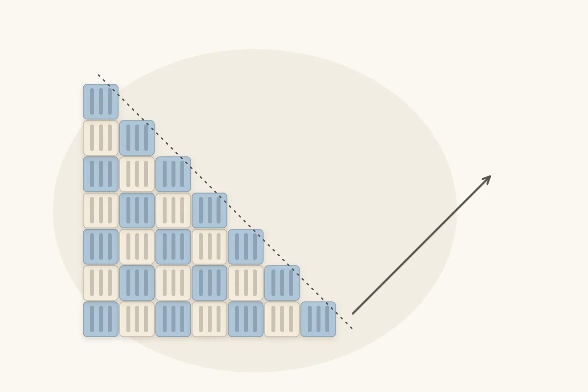 A triangle of crochet blocks growing diagonally from one corner, with an arrow showing the direction of the rows