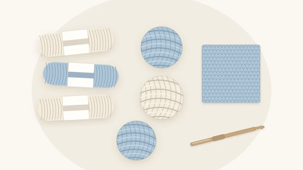 Six skeins and balls of yarn in cream and pale blue lined up beside a small crochet swatch and a crochet hook