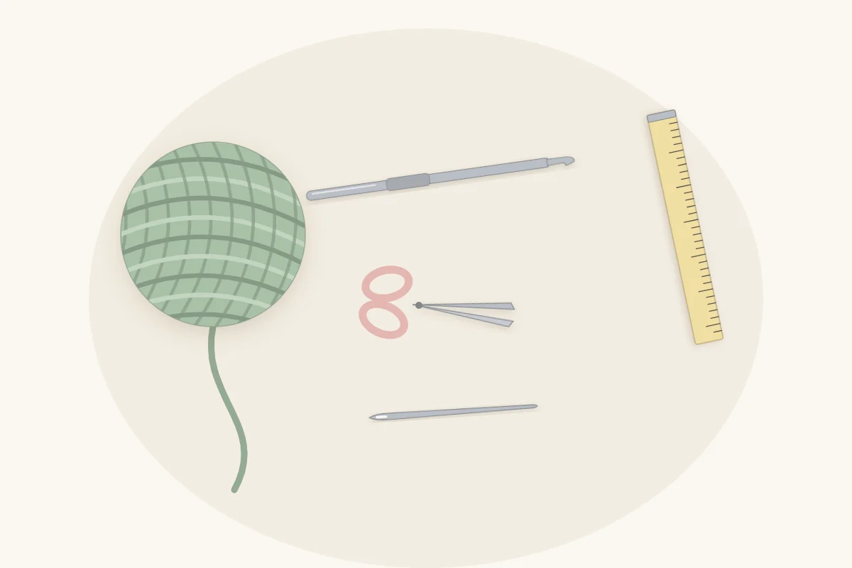 Flat lay of beginner crochet tools: one ball of yarn, a crochet hook, small scissors, a blunt yarn needle and a tape measure