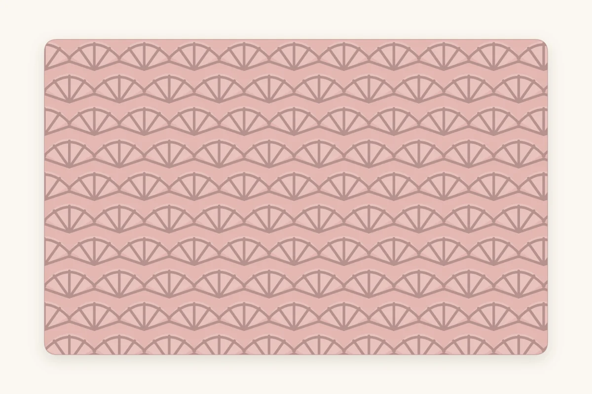 Close-up of shell stitch fabric showing rows of fan-shaped stitch groups stacked in an offset pattern